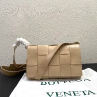 Bottega Veneta Medium Cassette Crossbody Bag with Triangle Buckle In Intreccio Wax Leather Apricot